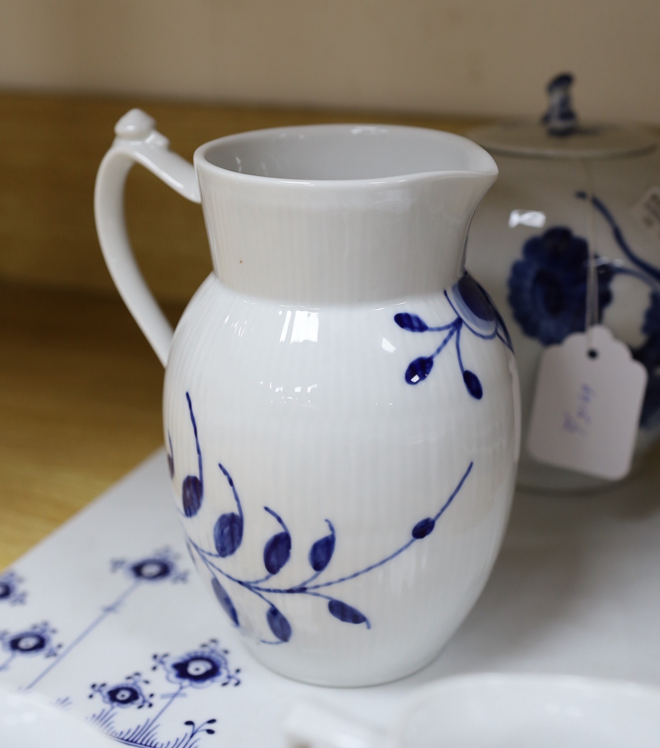 A collection of varying patterns of Royal Copenhagen blue and white tableware